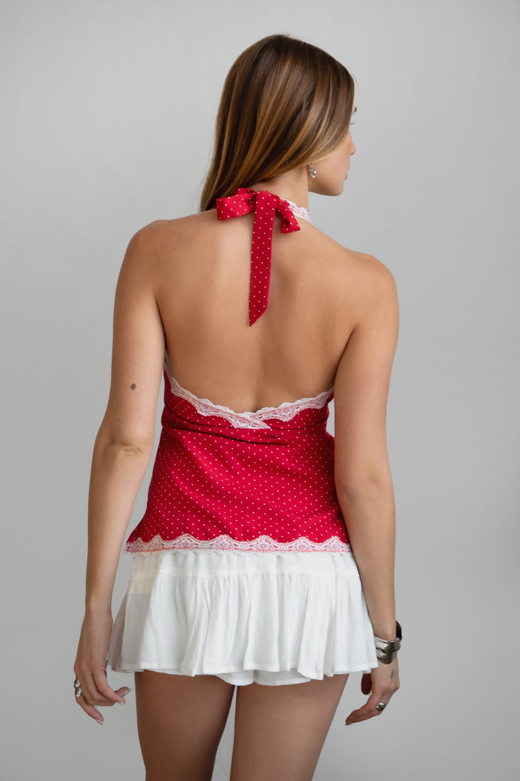 TIC TOC KACIE Polka Dot Halter Cami Top in red with plunging V neckline, lace hem, and open back.