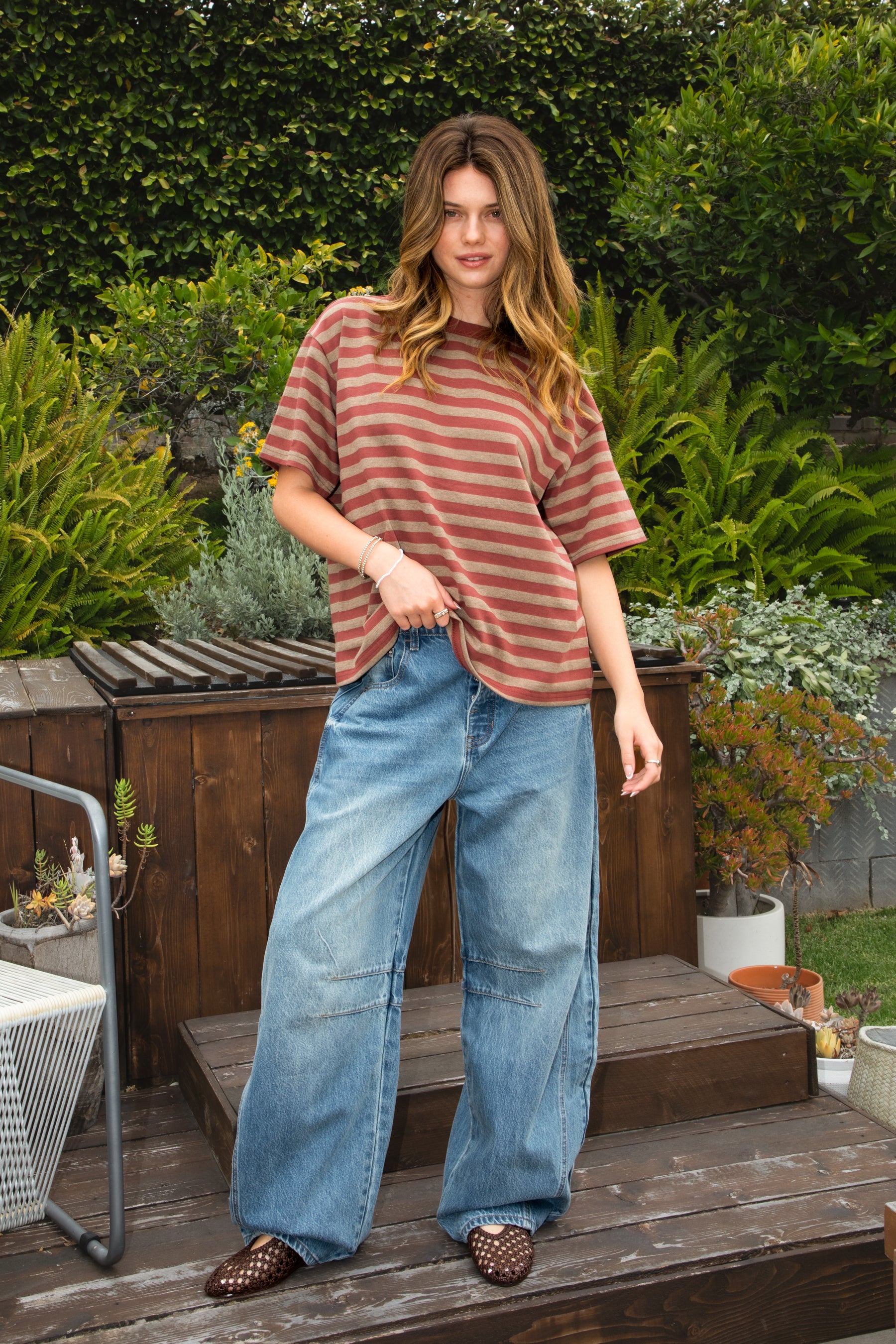 Woman wearing MARIN classic crewneck oversized striped short sleeve top featuring a timeless crew neckline, relaxed oversized fit, drop shoulder sleeves, soft horizontal stripe pattern, breathable 100% cotton fabric, and clean straight hem for everyday casual styling.