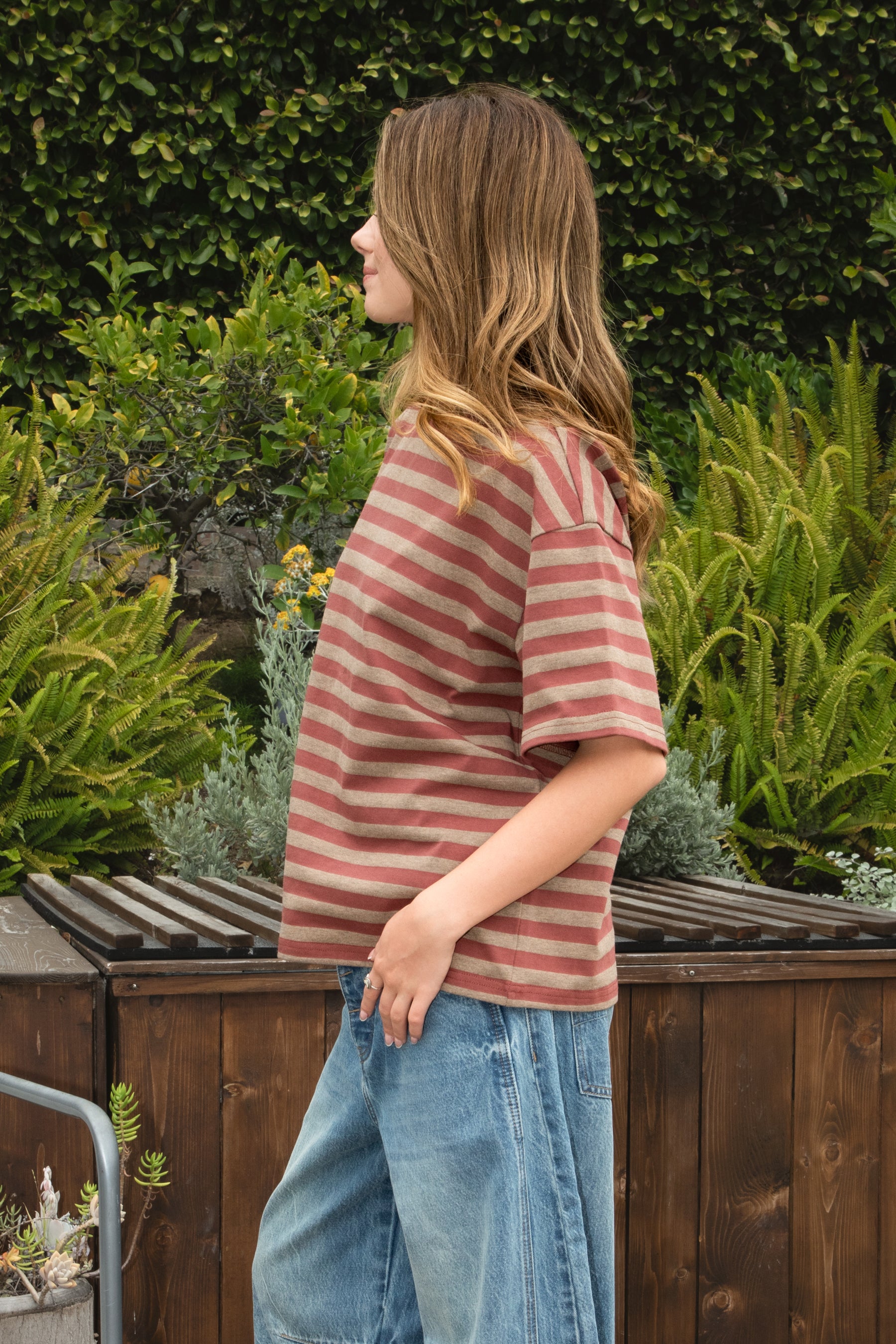 Woman wearing MARIN classic crewneck oversized striped short sleeve top featuring a timeless crew neckline, relaxed oversized fit, drop shoulder sleeves, soft horizontal stripe pattern, breathable 100% cotton fabric, and clean straight hem for everyday casual styling.