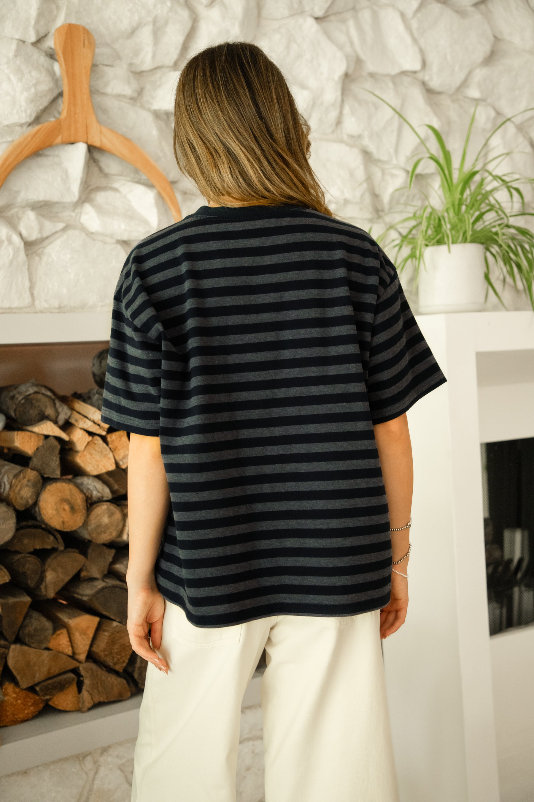 Woman wearing MARIN classic crewneck oversized striped short sleeve top featuring a timeless crew neckline, relaxed oversized fit, drop shoulder sleeves, soft horizontal stripe pattern, breathable 100% cotton fabric, and clean straight hem for everyday casual styling.