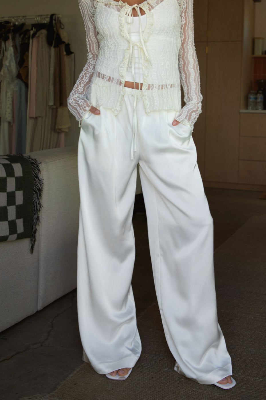 Woman wearing TIC TOC VERONA Satin Pull-On Pants in Cream front view with wide leg silhouette.