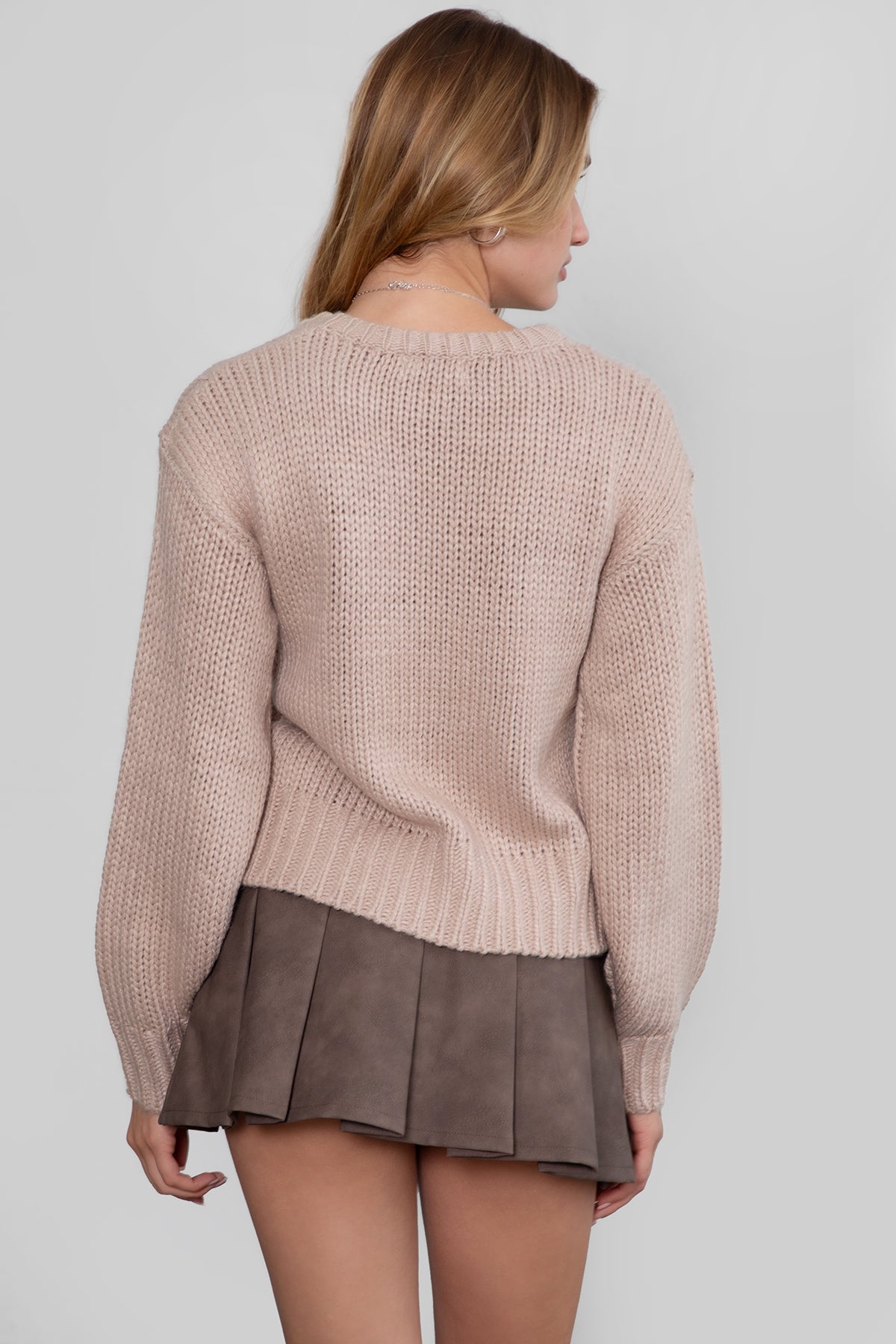 Model wearing TIC TOC KELLY Ribbed Knit Sweater Styled fall outfit with pu leather mini skirt
