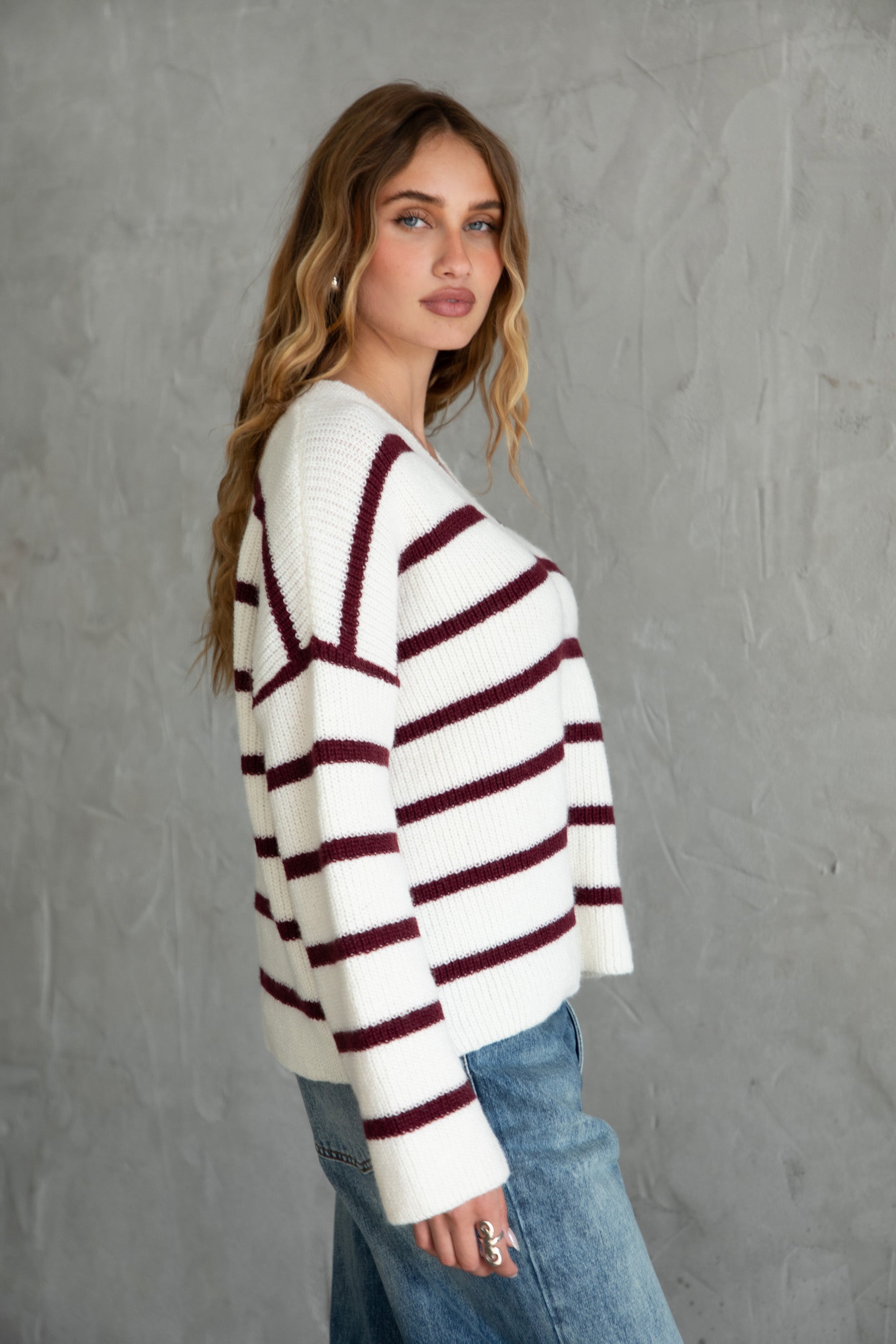 TIC TOC GENIVA Striped Sweater Cardigan Side view showing loose sleeve and boxy silhouette.