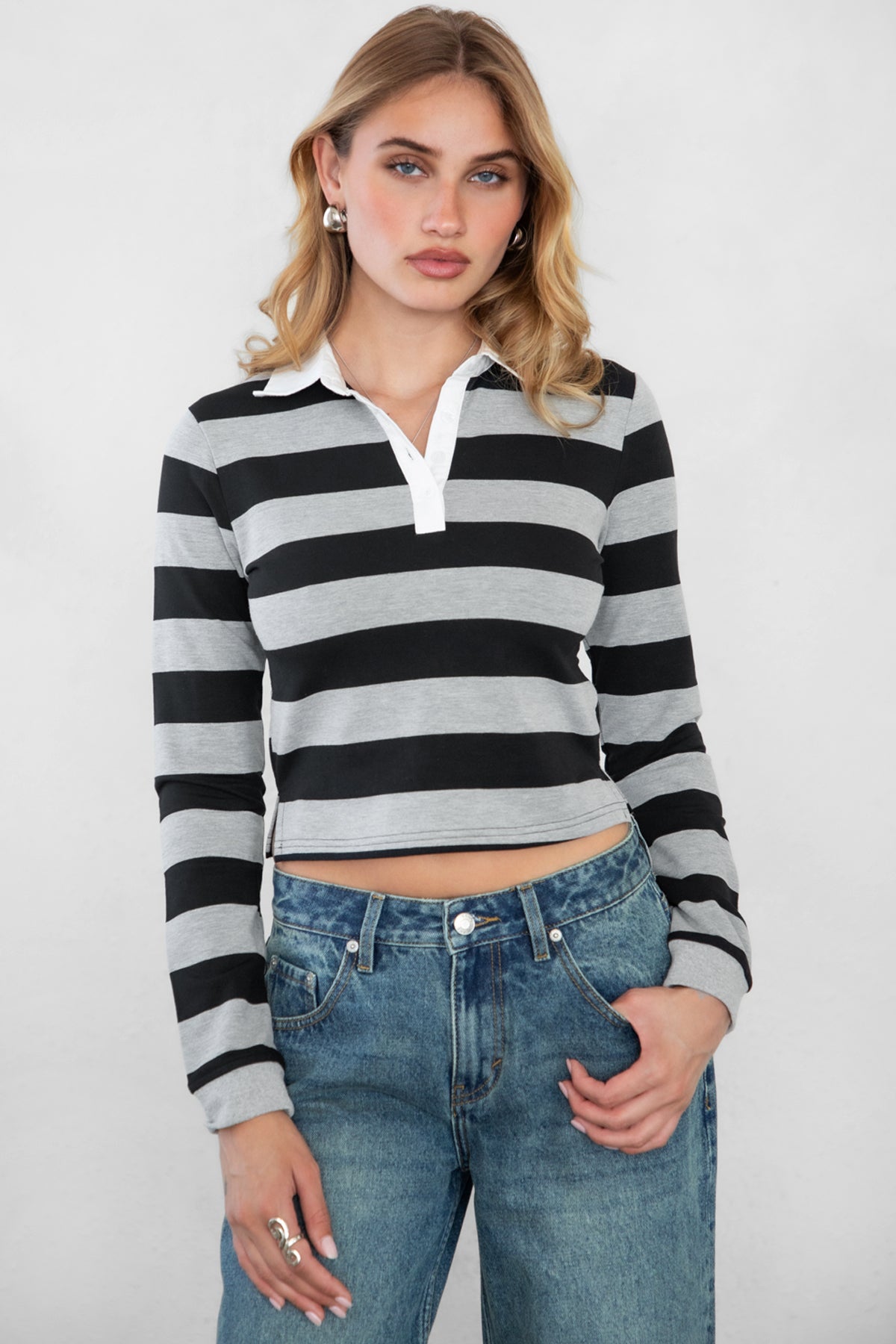Woman wearing TIC TOC TOMMY Rugby Striped Long Sleeve Shirt in grey black with denim jeans shwoing the front detail