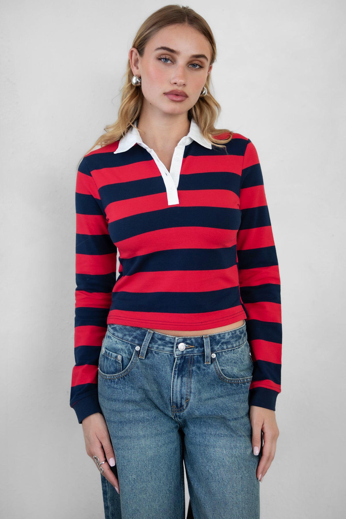 Woman wearing TIC TOC TOMMY Rugby Striped Long Sleeve Shirt in red navy with denim jeans, showing the front detail