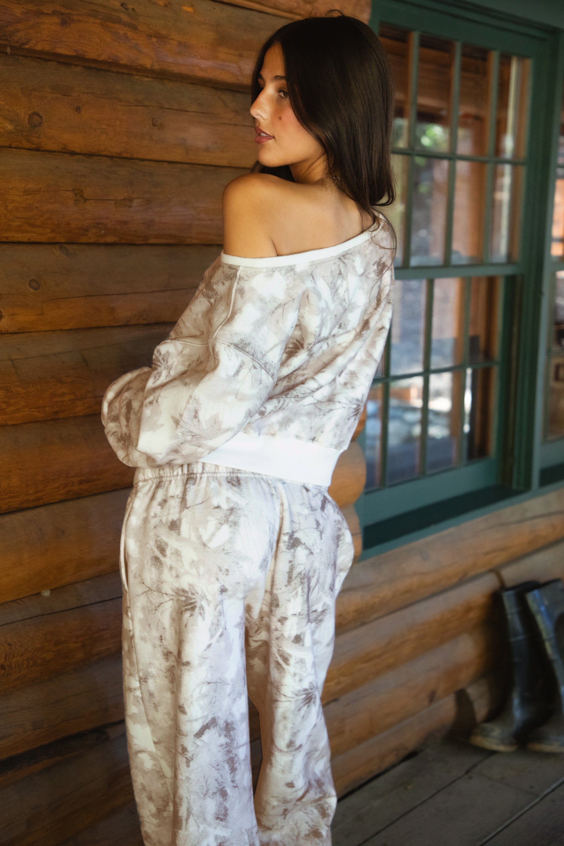 Women wearing TIC TOC AVERY Off The Shoulder Woodland Camo Sweatshirt with ribbed hem and cuffs, made from soft Cloud Fleece.