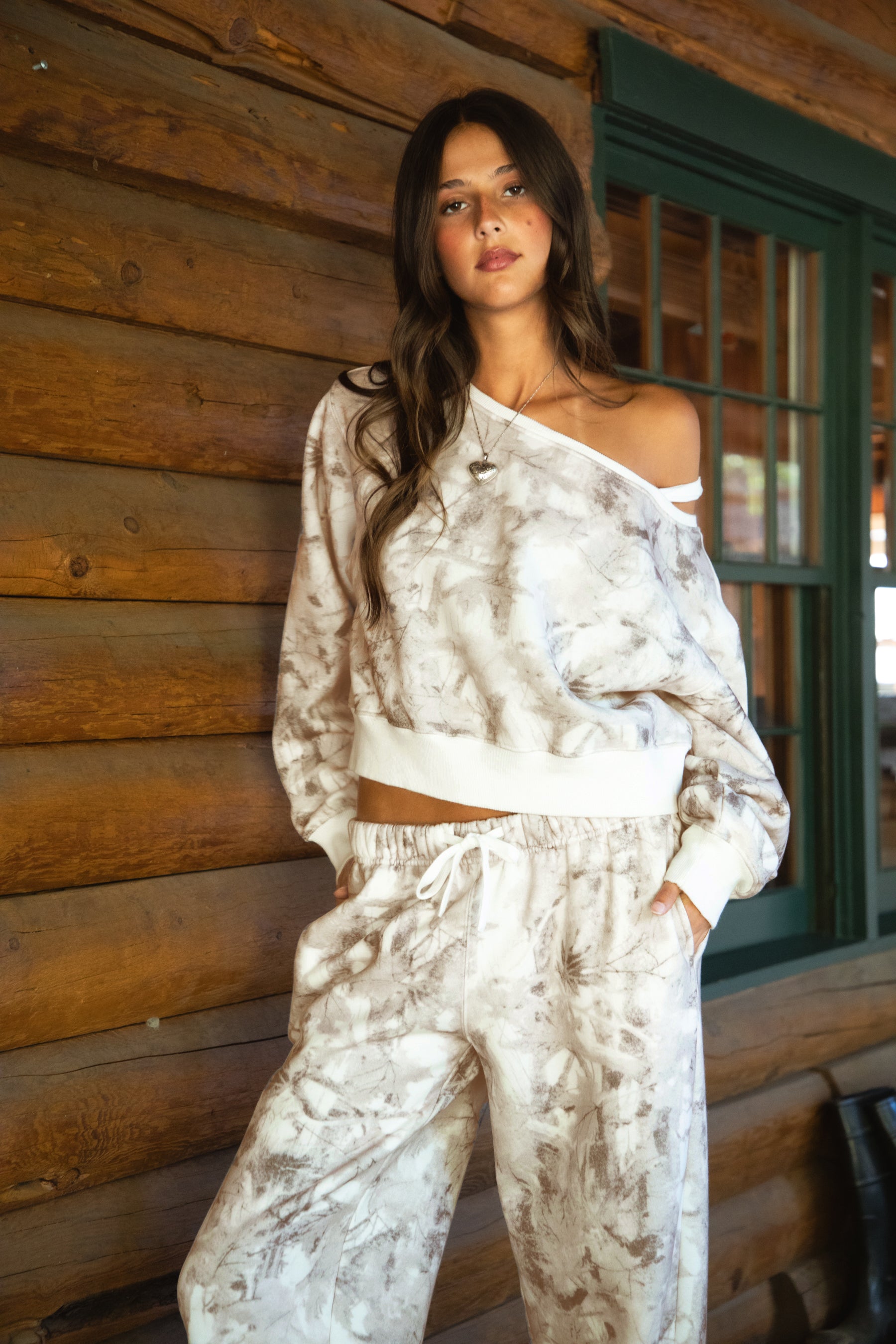 Women wearing TIC TOC AVERY Off The Shoulder Woodland Camo Sweatshirt with ribbed hem and cuffs, made from soft Cloud Fleece.