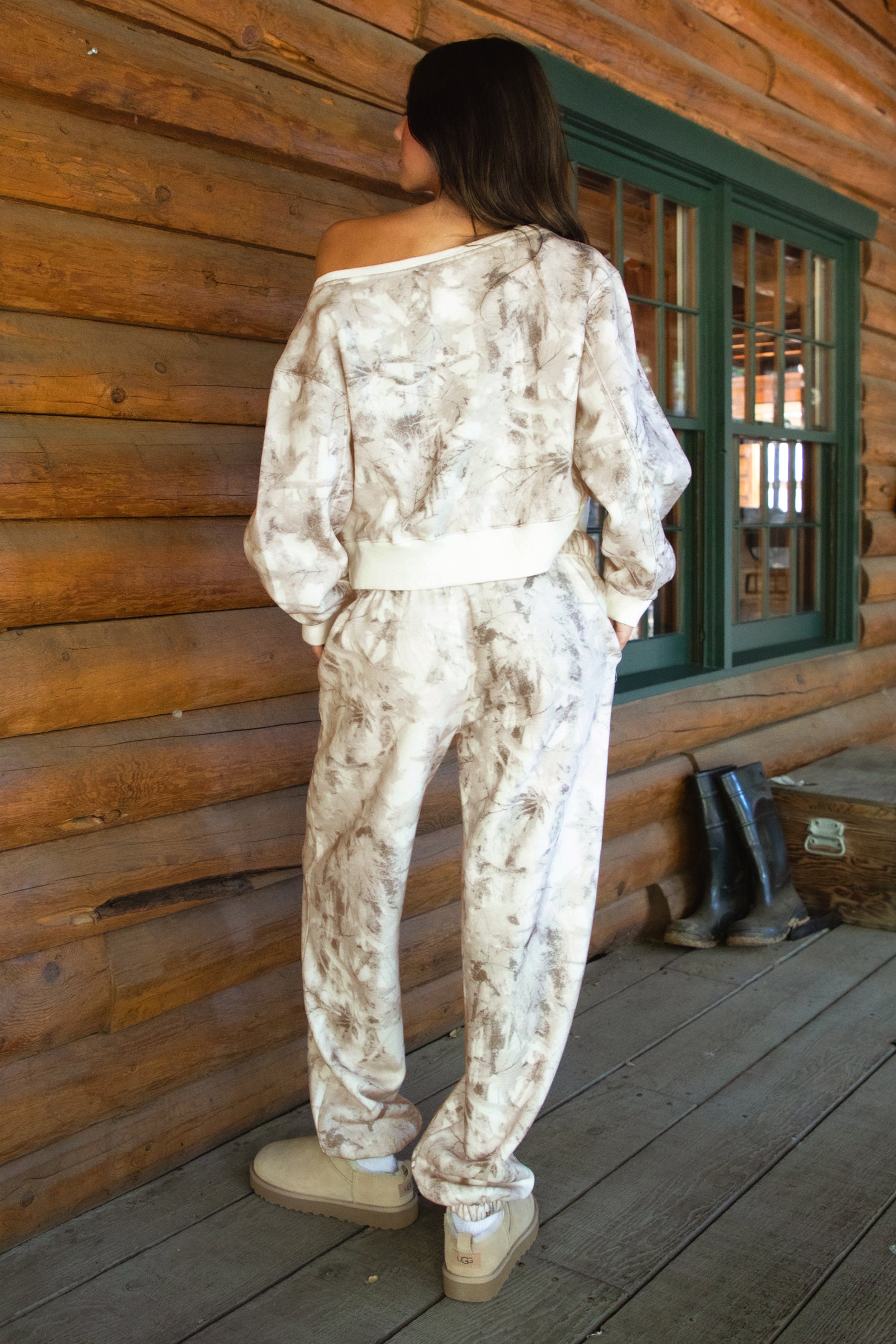 Women wearing TIC TOC AVERY Off The Shoulder Woodland Camo Sweatshirt with ribbed hem and cuffs, made from soft Cloud Fleece.