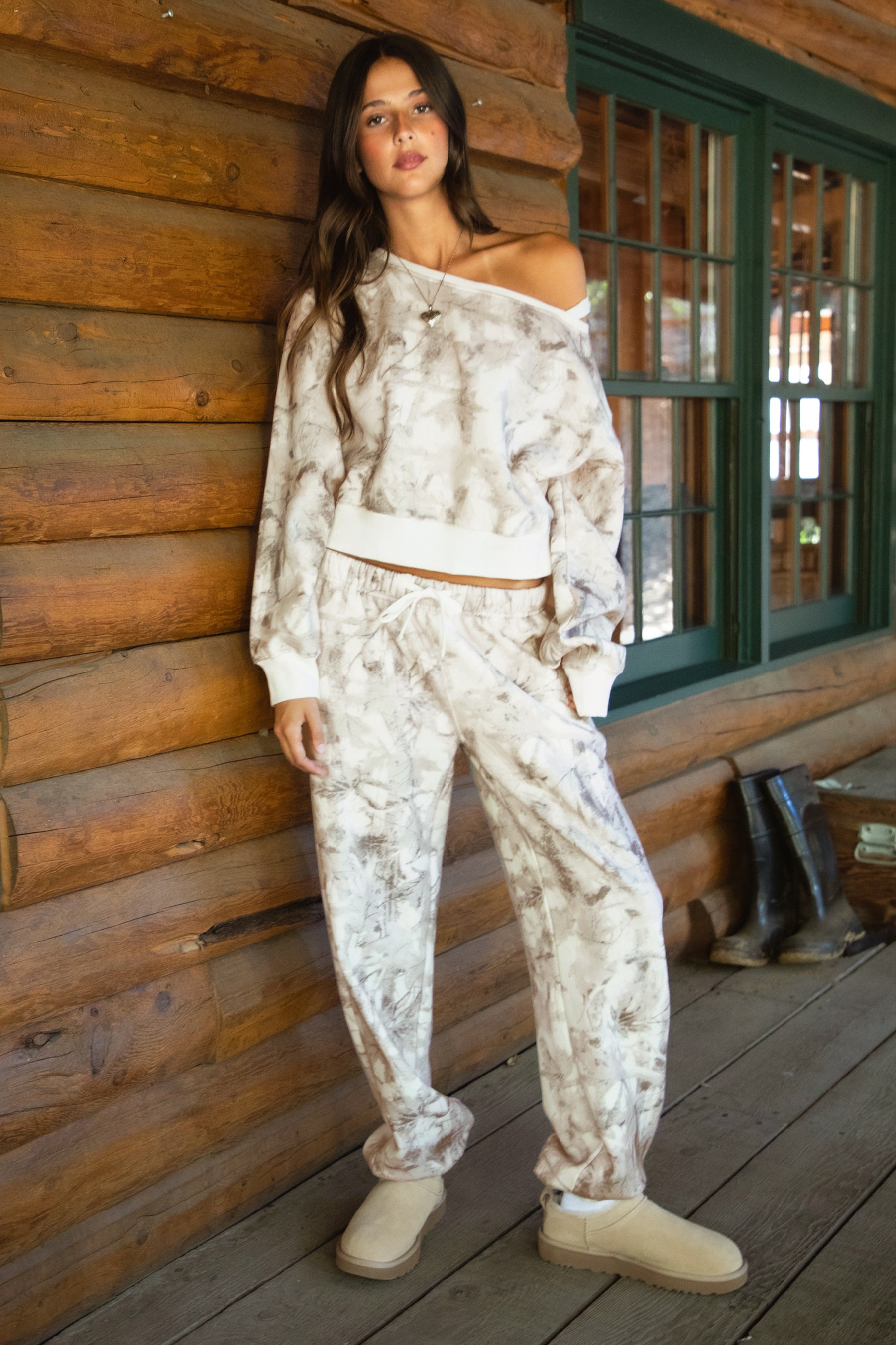 Women wearing TIC TOC AVERY Off The Shoulder Woodland Camo Sweatshirt with ribbed hem and cuffs, made from soft Cloud Fleece.