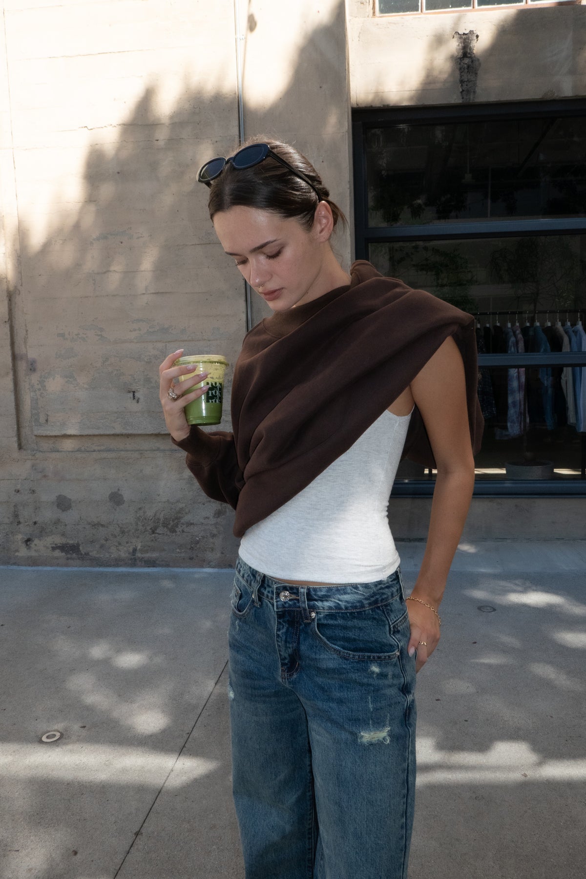 Woman wearing LANI mock neck cloud fleece sweatshirt featuring soft cotton blend cloud fleece fabric, ribbed mock neckline, relaxed oversized fit, dropped shoulder design, long sleeves with ribbed cuffs, triangle stitch detail at center front, and ribbed hem for a cozy comfortable finish.