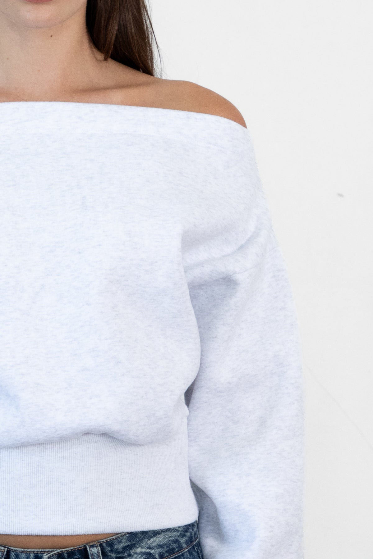 Woman wearing LANI mock neck cloud fleece sweatshirt featuring soft cotton blend cloud fleece fabric, ribbed mock neckline, relaxed oversized fit, dropped shoulder design, long sleeves with ribbed cuffs, triangle stitch detail at center front, and ribbed hem for a cozy comfortable finish.