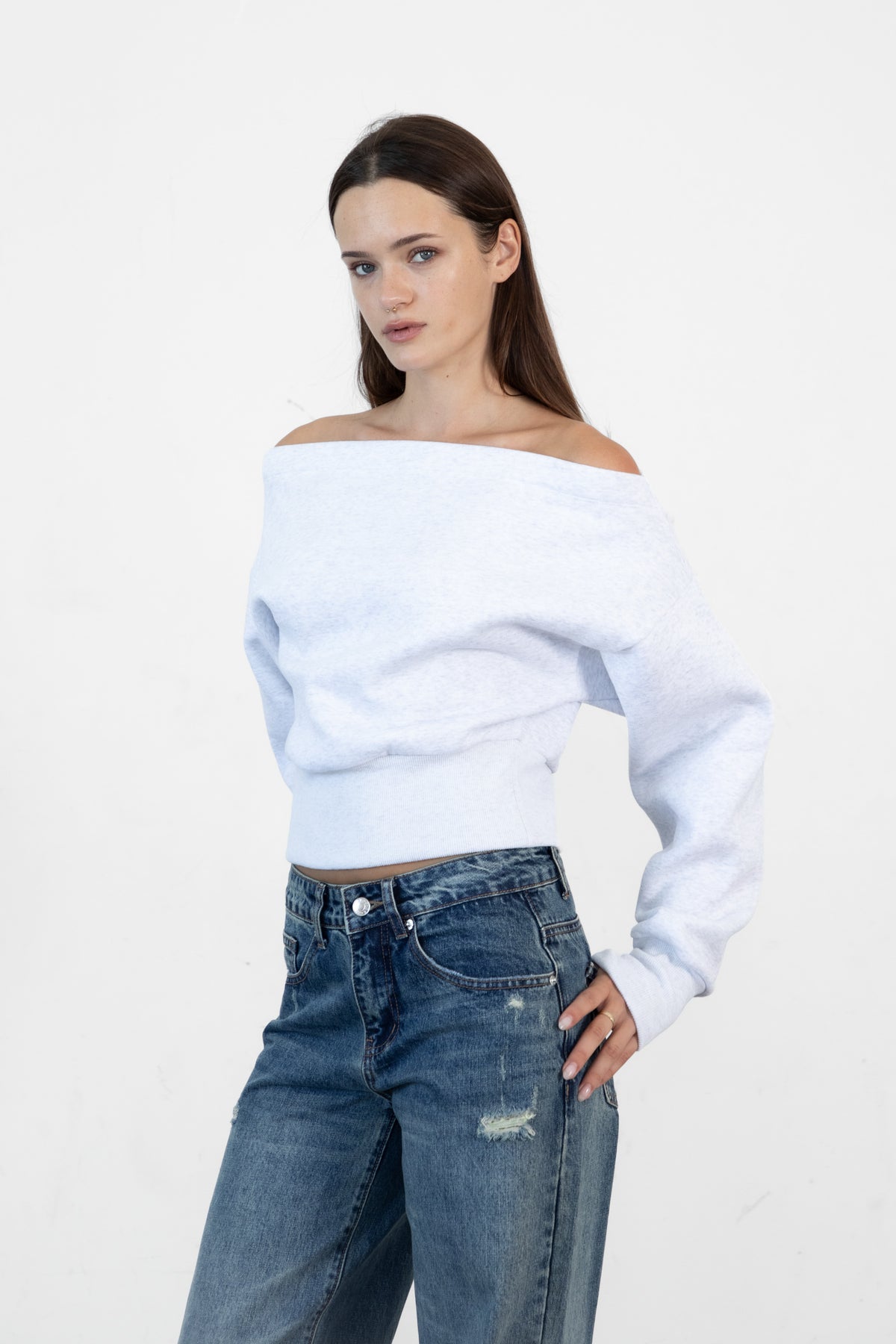 Woman wearing LANI mock neck cloud fleece sweatshirt featuring soft cotton blend cloud fleece fabric, ribbed mock neckline, relaxed oversized fit, dropped shoulder design, long sleeves with ribbed cuffs, triangle stitch detail at center front, and ribbed hem for a cozy comfortable finish.
