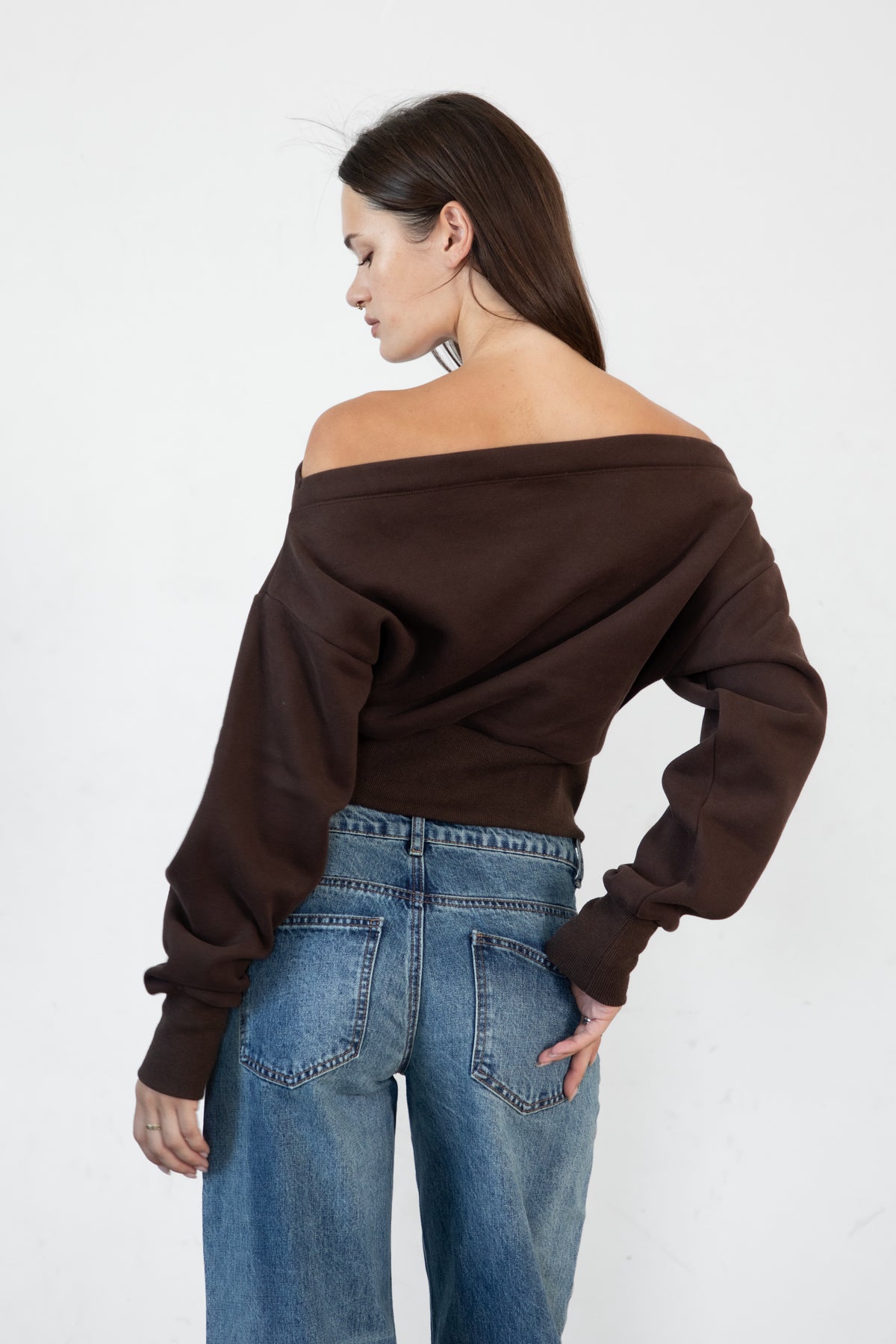 Woman wearing LANI mock neck cloud fleece sweatshirt featuring soft cotton blend cloud fleece fabric, ribbed mock neckline, relaxed oversized fit, dropped shoulder design, long sleeves with ribbed cuffs, triangle stitch detail at center front, and ribbed hem for a cozy comfortable finish.