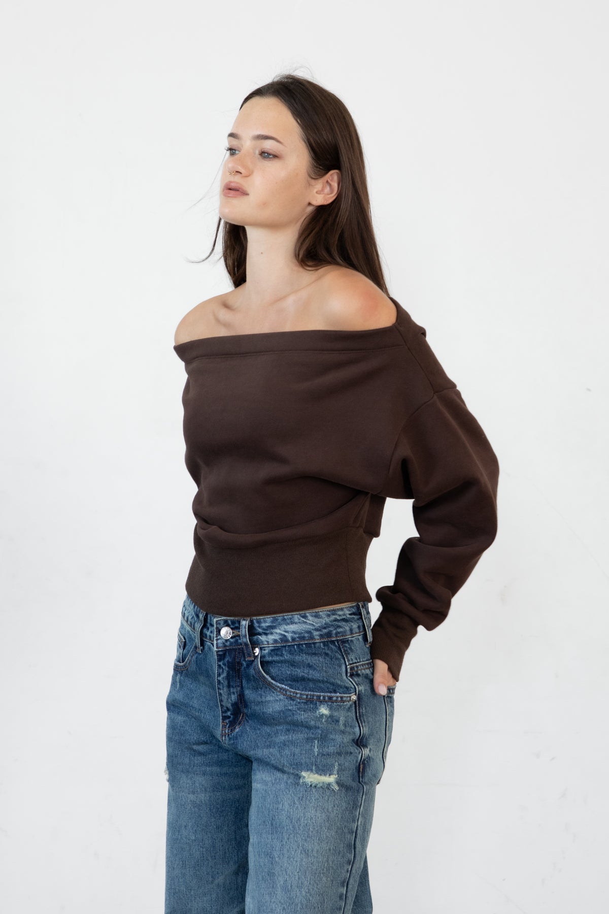 Woman wearing LANI mock neck cloud fleece sweatshirt featuring soft cotton blend cloud fleece fabric, ribbed mock neckline, relaxed oversized fit, dropped shoulder design, long sleeves with ribbed cuffs, triangle stitch detail at center front, and ribbed hem for a cozy comfortable finish.