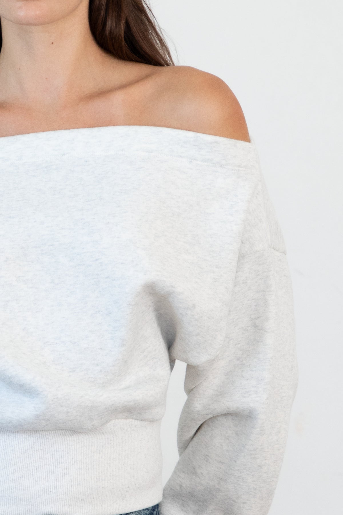 Woman wearing LANI mock neck cloud fleece sweatshirt featuring soft cotton blend cloud fleece fabric, ribbed mock neckline, relaxed oversized fit, dropped shoulder design, long sleeves with ribbed cuffs, triangle stitch detail at center front, and ribbed hem for a cozy comfortable finish.