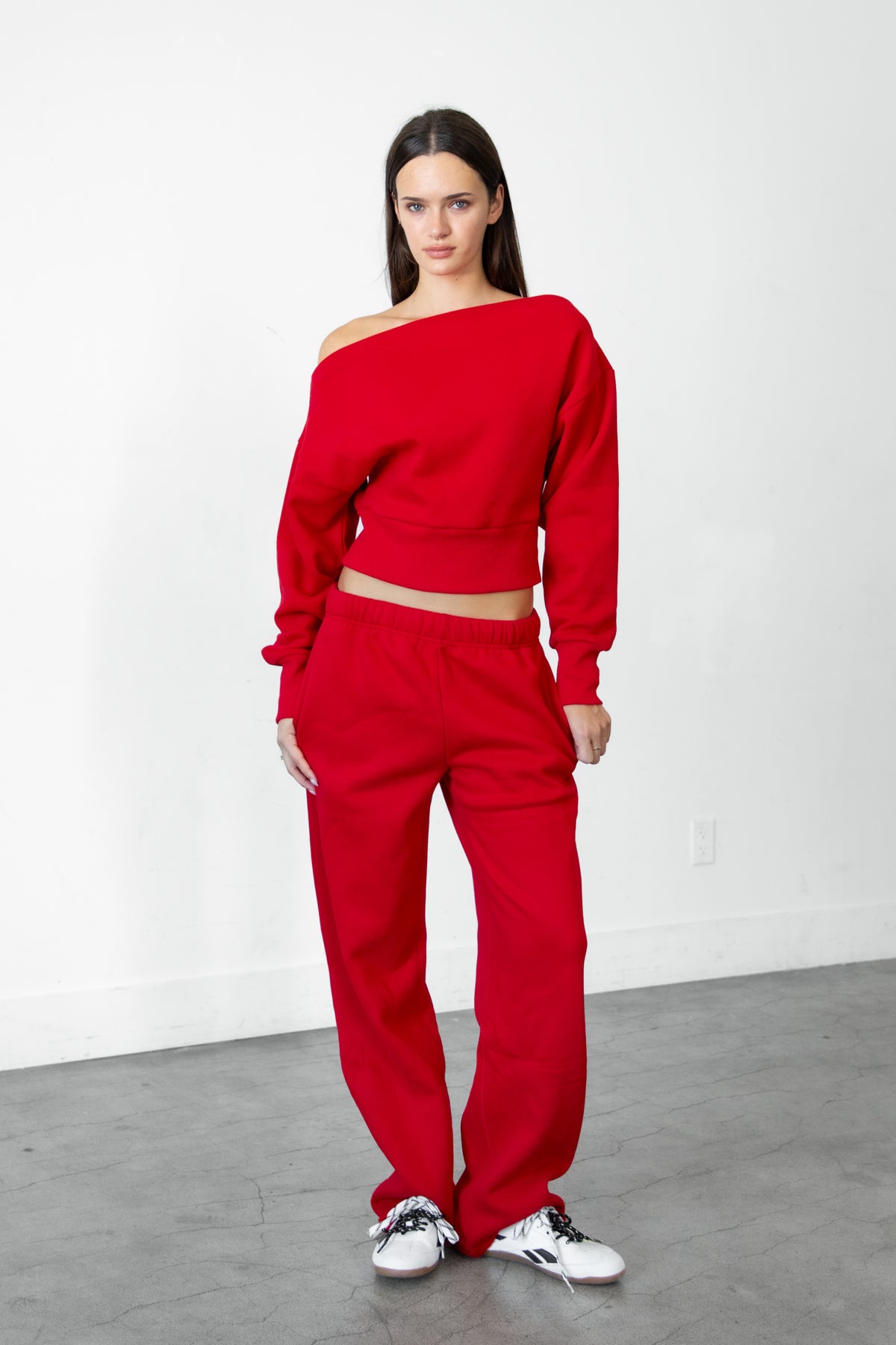 Woman wearing LANI mock neck cloud fleece sweatshirt featuring soft cotton blend cloud fleece fabric, ribbed mock neckline, relaxed oversized fit, dropped shoulder design, long sleeves with ribbed cuffs, triangle stitch detail at center front, and ribbed hem for a cozy comfortable finish.