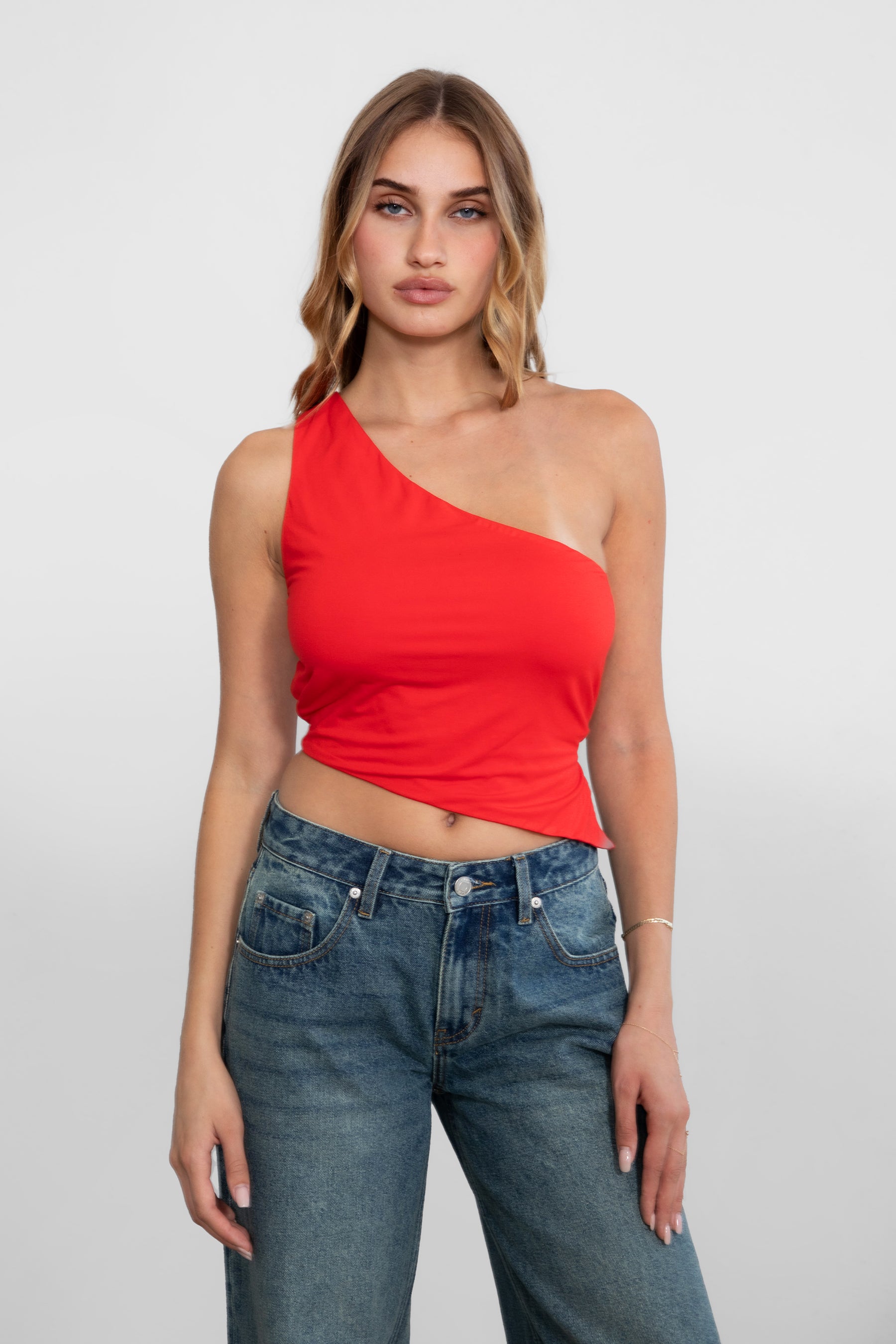 TIC TOC JIJI One Shoulder Asymmetrical Tank Top in Red with open back, long angled hem, and adjustable tie closures.